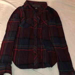 Large woman’s maroon and navy blue flannel